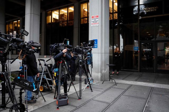 Media gather outside Los Angeles Superior Court where Nick Reiner, son of the late US film director Rob Reiner, is expected to be arraigned on double murder charges, December 17, 2025 in Los Angeles, California. The son of famed Hollywood director Rob Reiner was charged with two counts of first-degree murder over the brutal slaying of his parents, the chief prosecutor of Los Angeles said on December 16. (Photo by Caroline Brehman / POOL / AFP)