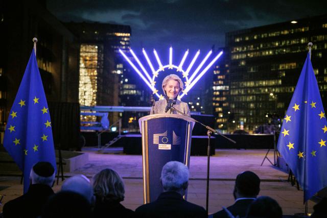 European Commission President Ursula von der Leyen speaks as she takes part in the Euro-Chanukah event organized by the European Jewish Community Center (EJCC) together with the European Jewish Association (EJA) outside the European Union buildings in Brussels on December 17, 2025. (Photo by Simon Wohlfahrt / AFP)