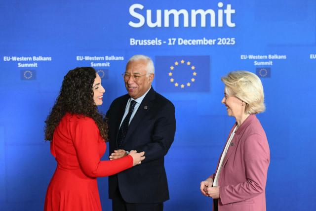 European Council President Antonio Costa (L) and Van European Commission President Ursula Von der Leyen (R) welcome Kosovo's President Vjosa Osmani (L) as they arrive to attend the EU Western Balkans summit ahead of the European Council in Brussels on December 17, 2025. (Photo by NICOLAS TUCAT / AFP)