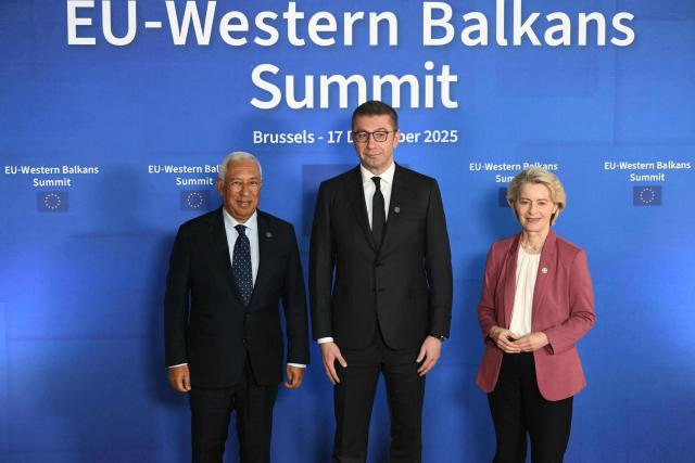 European Council President Antonio Costa (L) and Van European Commission President Ursula Von der Leyen (R) pose with North Macedonia's Prime Minister Hristijan Mickoski (C) upon their arrival to attend the EU Western Balkans summit ahead of the European Council in Brussels on December 17, 2025. (Photo by NICOLAS TUCAT / AFP)