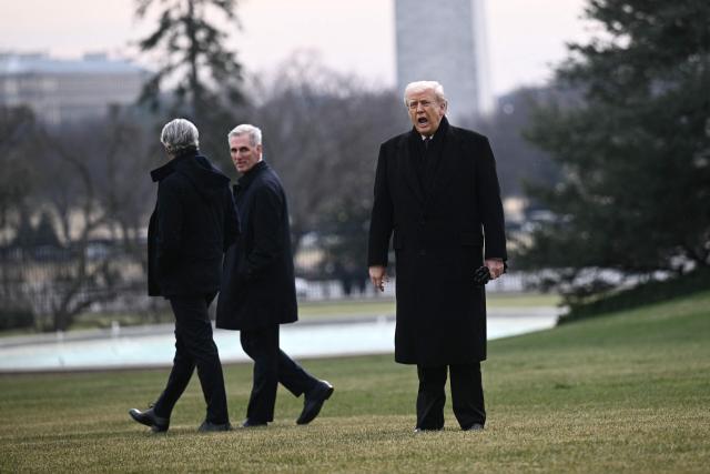 US President Donald Trump stops to talks to the press as he walks to board Marine One as he departs from the South Lawn of the White House in Washington, DC, on December 17, 2025 to attend a ceremony for the return of two US servicemen killed in Syria at Dover Air Force Base in Delaware. (Photo by Brendan SMIALOWSKI / AFP)