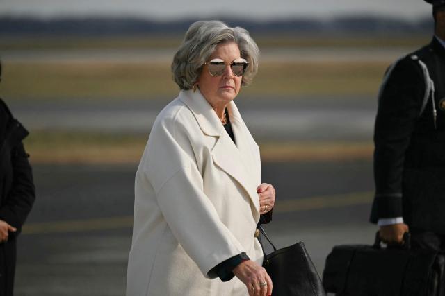 White House Chief of Staff Susie Wiles walks as she arrives at Dover Air Force Base in Delaware on December 17, 2025. US President Donald Trump is attending a ceremony for the return of two US servicemen killed in Syria at Dover Air Force Base in Delaware. (Photo by ANDREW CABALLERO-REYNOLDS / AFP)