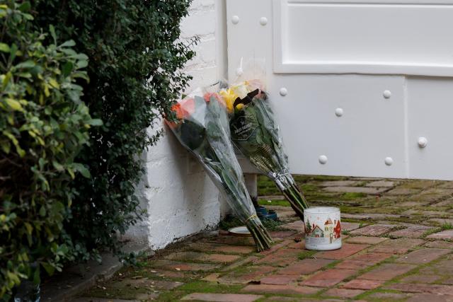 Flowers and candles sit outside US actor and director Rob Reiner's mansion in the Brentwood neighborhood of Los Angeles, California, on  December 17, 2025 in Los Angeles, California. The son of famed Hollywood director Rob Reiner was charged with two counts of first-degree murder over the brutal slaying of his parents, the chief prosecutor of Los Angeles said on December 16. Rob Reiner, 78, and his wife Michele Singer Reiner, 70, were found dead in their home on December 15, 2025. (Photo by Caroline Brehman / AFP)