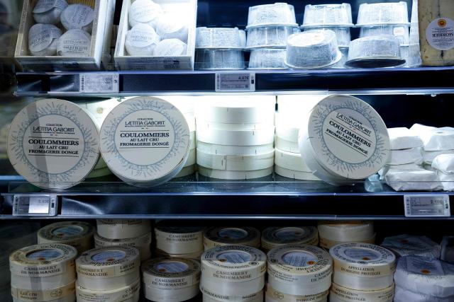 This photograph shows cheeses displayed at the multinational wholesale chain 'Metro' flagship store in Nanterre during a press visit, in western Paris, on December 17, 2025. (Photo by Charlotte SIEMON / AFP)