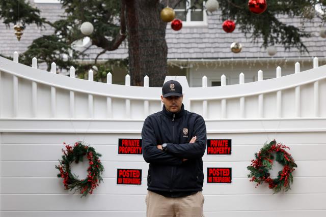 A security guard stands outside US actor and director Rob Reiner's mansion in the Brentwood neighborhood of Los Angeles, California, on  December 17, 2025 in Los Angeles, California. The son of famed Hollywood director Rob Reiner was charged with two counts of first-degree murder over the brutal slaying of his parents, the chief prosecutor of Los Angeles said on December 16. Rob Reiner, 78, and his wife Michele Singer Reiner, 70, were found dead in their home on December 15, 2025. (Photo by Caroline Brehman / AFP)