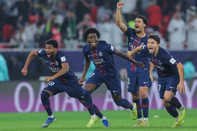 PSG's players celebrate at the end of the penalty shootout after winning the 2025 FIFA Intercontinental Cup final football match between Paris Saint-Germain (PSG) and CR Flamengo at the Ahmad bin Ali Stadium in Al-Rayyan on the outskirts of Doha on December 17, 2025. (Photo by Karim JAAFAR / AFP)