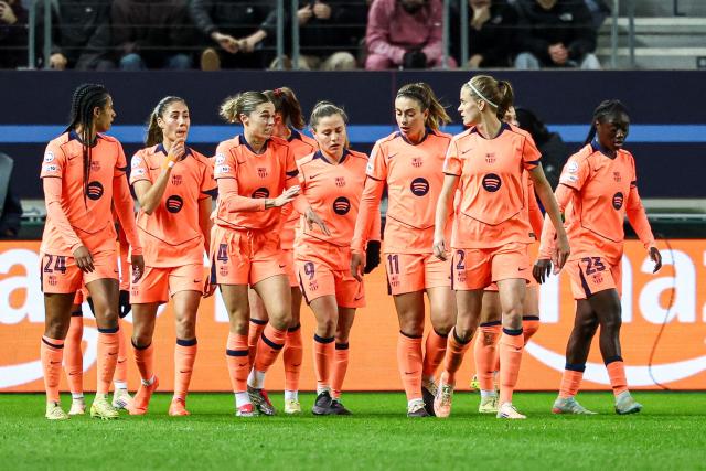 Barcelona's players celebrate their team's first goal during the UEFA Women's Champions League group-stage football match between Paris FC and FC Barcelona at the Stade Jean-Bouin, in Paris, on december 17, 2025. (Photo by FRANCK FIFE / AFP)