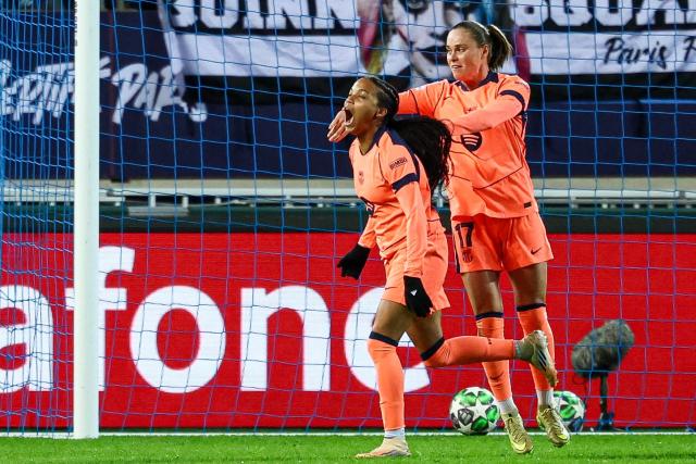Barcelona's Spanish forward #19 Victoria Lopez celebrates scoring her team's first goal next to Barcelona's Polish forward #17 Ewa Pajor during the UEFA Women's Champions League group-stage football match between Paris FC and FC Barcelona at the Stade Jean-Bouin, in Paris, on december 17, 2025. (Photo by FRANCK FIFE / AFP)