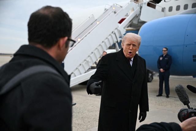 US President Donald Trump speaks to reporters after stepping off Air Force One at Joint Base Andrews on December 17, 2025 upon return from Dover Air Force Base in Delaware where he attended a ceremony for the return of the remains of two Iowa National Guard members and a translator killed in an attack in Syria. (Photo by ANDREW CABALLERO-REYNOLDS / AFP)