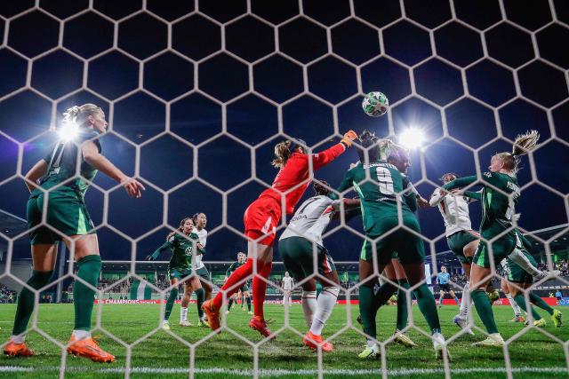 VfL Wolfsburg's German goalkeeper #01 Stina Johannes (C) fails to save the 1-1 goal during the UEFA Women's Champions League football match VfL Wolfsburg vs Chelsea FC in Wolfsburg, northern Germany, on December 17, 2025. (Photo by Ronny HARTMANN / AFP)