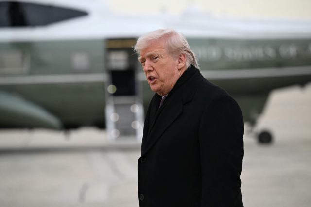US President Donald Trump speaks to reporters after stepping off Air Force One at Joint Base Andrews on December 17, 2025 upon return from Dover Air Force Base in Delaware where he attended a ceremony for the return of the remains of two Iowa National Guard members and a translator killed in an attack in Syria. (Photo by ANDREW CABALLERO-REYNOLDS / AFP)