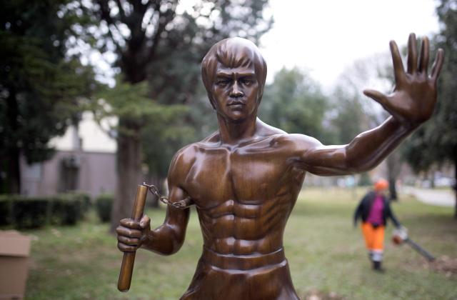 This photograph shows a restored statue honoring late martial arts legend Bruce Lee after returning to it's original location more than a year after it was stolen, in southern Bosnian city of Mostar, on December 17, 2025. The life-size bronze statue of the kung-fu cinema icon was originally unveiled in a park in Mostar in 2005 and has been vandalized several times since. Lee was chosen as a hero that all ethnic groups could relate to in a town that remains deeply divided after fierce fighting between Bosnian Croats and Bosnian Muslims during the country's 1992-95 war. (Photo by AFP)