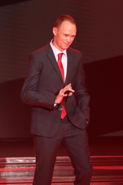 British cyclist Christopher Froome gestures during the presentation of the 81th edition of 'La Vuelta' cycling tour of Spain, in Monaco on December 17, 2025. The 2026 Vuelta a Espana will start with a time-trial in Monaco and finish in Granada, after organisers on December 17, 2025 unveiled what they say will be one of the most difficult routes in the race's history. (Photo by Valery HACHE / AFP)