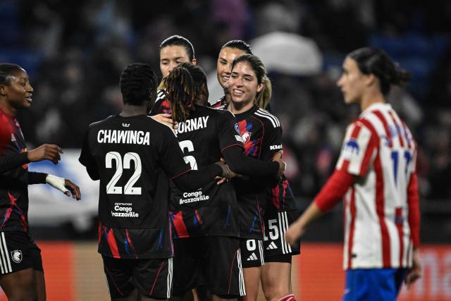 Lyon's US midfielder #08 Korbin Rose Shrader (C) celebrates with teammates after scoring Lyon's fourth goal during the UEFA Champions League group-stage football match between Olympique Lyonnais (OL) and Atlético Madrid at the Groupama Stadium in Decines-Charpieu, central-eastern France, on December 17, 2025. (Photo by JEFF PACHOUD / AFP)
