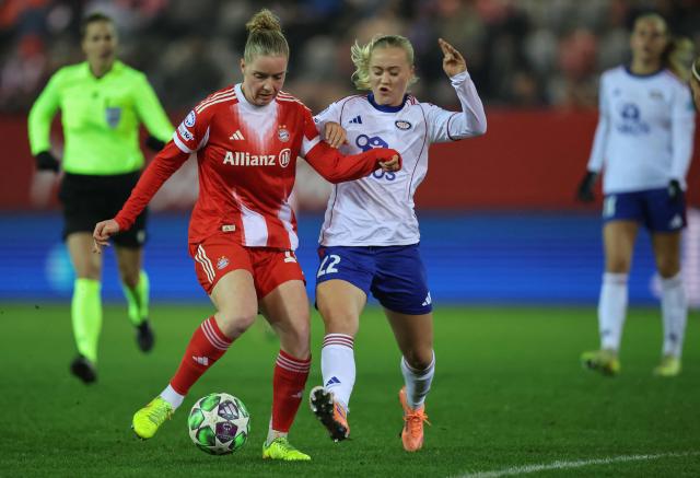 Bayern Munich's German midfielder #14 Alara Sehitler and Valerenga Fotball's Norwegian midfielder #22 Tomine Enger vie for the ball during the UEFA Women's Champions League football match FC Bayern Munich vs Valerenga Fotball in Munich, southern Germany on December 17, 2025. (Photo by Alexandra BEIER / AFP)