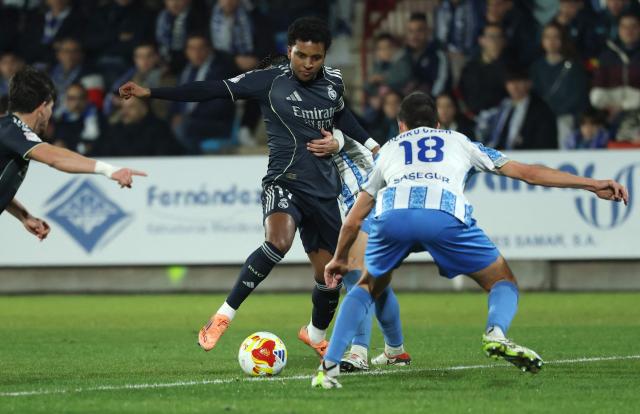 Real Madrid's Brazilian forward #11 Rodrygo controls the ball during the Spanish Copa del Rey (King's Cup) round of 32 second leg football match between Talavera CF and Real Madrid CF at El Prado Municipal Stadium in Talavera de la Reina on December 17, 2025. (Photo by Thomas COEX / AFP)