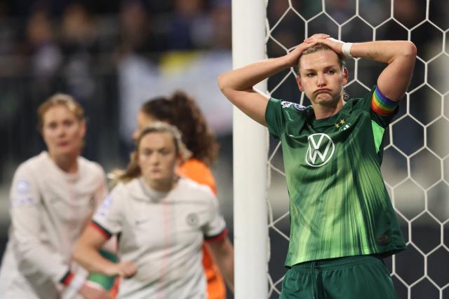VfL Wolfsburg's German forward #11 Alexandra Popp (R) reacts during the UEFA Women's Champions League football match VfL Wolfsburg vs Chelsea FC in Wolfsburg, northern Germany, on December 17, 2025. (Photo by Ronny HARTMANN / AFP)