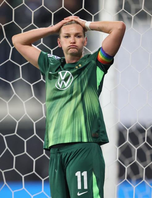 VfL Wolfsburg's German forward #11 Alexandra Popp reacts during the UEFA Women's Champions League football match VfL Wolfsburg vs Chelsea FC in Wolfsburg, northern Germany, on December 17, 2025. (Photo by Ronny HARTMANN / AFP)