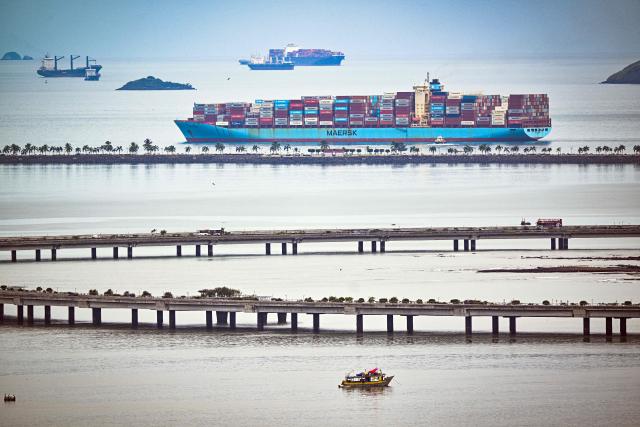 (FILES) The Clifford Maersk cargo ship leaves the Panama Canal on the Pacific Ocean side in Panama City on September 2, 2025. Panama earned record revenue from its interoceanic canal operations last year, marked by a recovery in transits following a drought, the canal authority reported on December 17, 2025. (Photo by Martin BERNETTI / AFP)