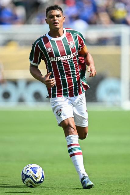 (FILES) Fluminense's Brazilian defender #03 Thiago Silva runs with the ball during the FIFA Club World Cup 2025 semifinal football match between Brazil's Fluminense and England's Chelsea at the MetLife stadium in East Rutherford, New Jersey on July 8, 2025. Brazilian center-back Thiago Silva terminated his contract with Fluminense, the Rio de Janeiro club said on December 17, 2025, as the experienced defender is reportedly aiming to return to Europe according to local media. (Photo by Paul ELLIS / AFP)