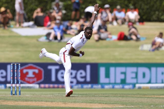 West Indies Jayden Seales bowls during day one of the 3rd international Test cricket match between New Zealand and West Indies at Bay Oval in Mount Maunganui on December 18, 2025. (Photo by Michael Bradley / AFP)