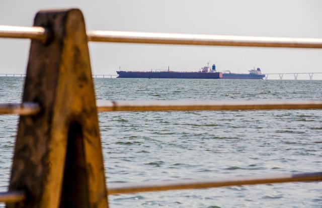 Two crude oil tankers remain anchored on Lake Maracaibo, near Maracaibo, Zulia state, Venezuela on December 17, 2025. (Photo by Alejandro Paredes / AFP)