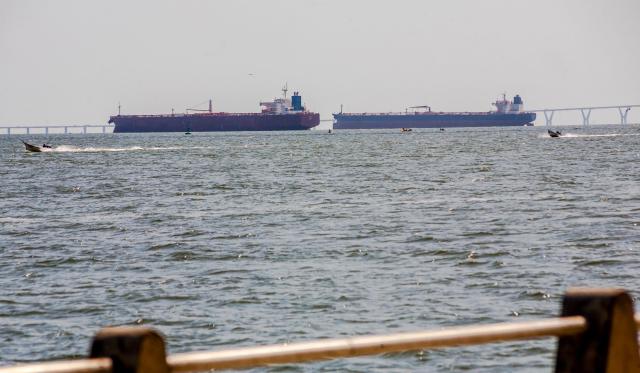 Two crude oil tankers remain anchored on Lake Maracaibo, near Maracaibo, Zulia state, Venezuela on December 17, 2025. (Photo by Alejandro Paredes / AFP)