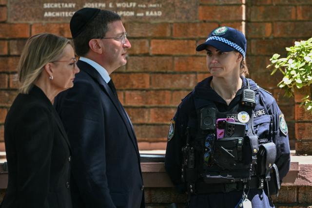 Leader of the opposition Liberal Party Sussan Ley (L) arrives for the funeral of 10-year-old Matilda, who was killed in the December 14 Bondi Beach shooting attack, in Sydney on December 18, 2025. The attack at Bondi Beach on December 14 was one of the deadliest in Australian history. (Photo by Saeed KHAN / AFP)