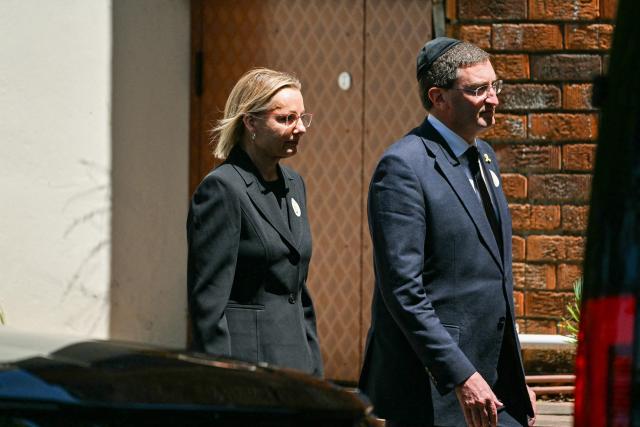Leader of the opposition Liberal Party Sussan Ley (L) arrives for the funeral of 10-year-old Matilda, who was killed in the December 14 Bondi Beach shooting attack, in Sydney on December 18, 2025. The attack at Bondi Beach on December 14 was one of the deadliest in Australian history. (Photo by Saeed KHAN / AFP)