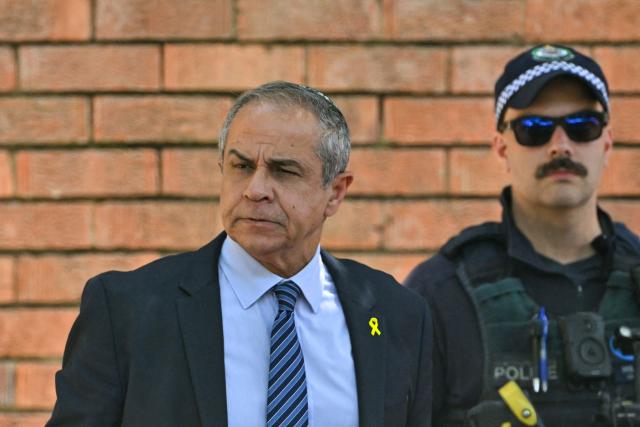 Israel's Ambassador to Australia Amir Maimon (L) arrives for the funeral of 10-year-old Matilda, who was killed in the December 14 Bondi Beach shooting attack, in Sydney on December 18, 2025. The attack at Bondi Beach on December 14 was one of the deadliest in Australian history. (Photo by Saeed KHAN / AFP)