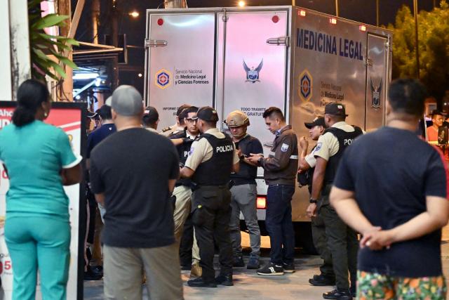 Forensic officers take records at the scene where Barcelona SC footballer Mario Pineida was killed in Guayaquil, Ecuador, on December 17, 2025. Ecuadorian footballer Mario Pineida was killed in an attack in the port city of Guayaquil on December 17, 2025, a hotspot for violence in the country due to drug trafficking, according to his club Ecuador's Barcelona. (Photo by MARCOS PIN / AFP)