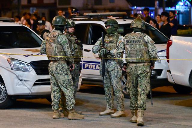 Military personnel guard the site where Barcelona SC footballer Mario Pineida was killed in Guayaquil, Ecuador, on December 17, 2025. Ecuadorian footballer Mario Pineida was killed in an attack in the port city of Guayaquil on December 17, 2025, a hotspot for violence in the country due to drug trafficking, according to his club Ecuador's Barcelona. (Photo by MARCOS PIN / AFP)