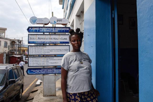 Mariatu Kamara poses for a portrait in front of the Planned Parenthood Sexual Reproductive Health Clinic in Freetown, on November 12, 2025. In Sierra Leone, where abortion is illegal unless a mother's life is at risk, women often go to drastic and dangerous lengths to terminate a pregnancy.
Abortion advocates were buoyed by a bill introduced in parliament last year and favoured by President Julius Maada Bio which would have decriminalized abortion.
But the measure has stalled with little sign of revival as many point to staunch opposition from Sierra Leone's religious Christian and Muslim communities as the cause. (Photo by Saidu BAH / AFP)