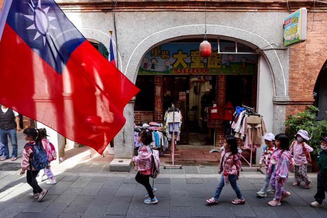 (FILES) Taiwan flags are pictured on the street in Kinmen on October 29, 2025. Donald Trump's administration has given its approval to sell $11 billion of weapons to Taiwan, the second batch of such sales since the US president returned to office, Taipei said on December 18, 2025. (Photo by I-Hwa CHENG / AFP)