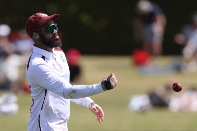 West Indies' John Campbell throws the ball during day one of the third international Test cricket match between New Zealand and West Indies at Bay Oval in Mount Maunganui on December 18, 2025. (Photo by Michael Bradley / AFP)
