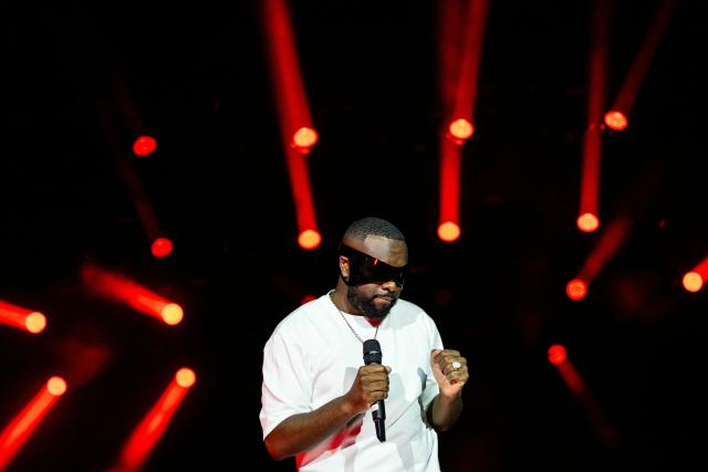 (FILES) Congolese singer, rapper, and singer-songwriter GIMS, formerly known as Maître Gims performs at the Golden Coast rap festival in Corcelles-les-Monts near Dijon, central eastern France, on September 6, 2025. Franco-Congolese rapper Gims will perform from December 19 to 22, 2025 at the 45,000-seat Paris La Defense Arena to end his tour. (Photo by ARNAUD FINISTRE / AFP)