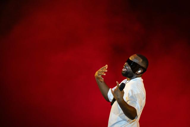(FILES) Congolese singer, rapper, and singer-songwriter GIMS, formerly known as Maître Gims performs at the Golden Coast rap festival in Corcelles-les-Monts near Dijon, central eastern France, on September 6, 2025. Franco-Congolese rapper Gims will perform from December 19 to 22, 2025 at the 45,000-seat Paris La Defense Arena to end his tour. (Photo by ARNAUD FINISTRE / AFP)