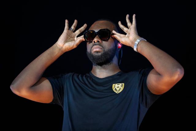 (FILES) French rapper Gandhi Djuna aka Gims performs during the "Fuego Tour" at the Stade de France in Saint-Denis, near Paris on September 28, 2019. Franco-Congolese rapper Gims will perform from December 19 to 22, 2025 at the 45,000-seat Paris La Defense Arena to end his tour. (Photo by Zakaria ABDELKAFI / AFP)