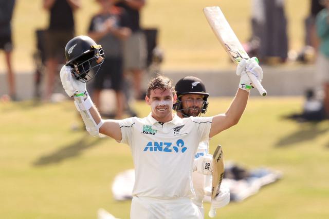 New Zealand’s Tom Latham (L) celebrates his century with Devon Conway during day one of the third international Test cricket match between New Zealand and West Indies at Bay Oval in Mount Maunganui on December 18, 2025. (Photo by Michael Bradley / AFP)