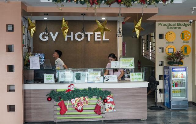 This photo taken on December 18, 2025 shows the front desk of the GV Hotel in Davao City, in the Philippines' southern island of Mindanao, where father-and-son duo Sajid and Naveed Akram stayed during their visit in November, weeks before they allegedly killed 15 people on Bondi Beach in Australia. Australian police are investigating whether the pair met with Islamist extremists during a visit to the Philippines weeks before the shooting. (Photo by Ferdinandh CABRERA / AFP)