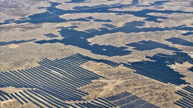 This picture shows an aerial view of solar panels on hilltops at the Yinchuan Fourth Photovoltaic Power Station in Yinchuan, in China’s northern Ningxia region on December 17, 2025. (Photo by AFP) / China OUT