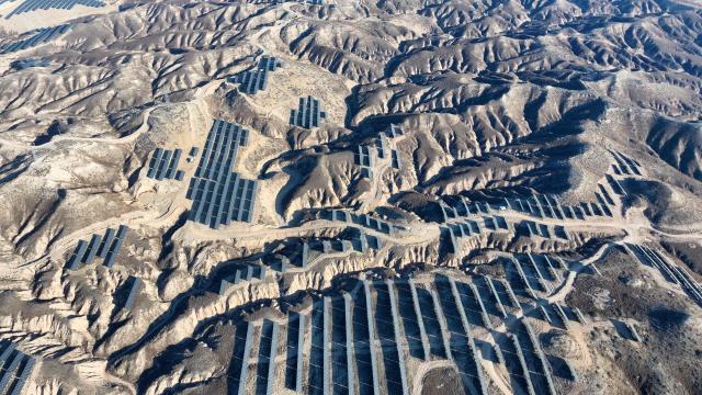 This picture shows an aerial view of solar panels on hilltops at the Yinchuan Fourth Photovoltaic Power Station in Yinchuan, in China’s northern Ningxia region on December 17, 2025. (Photo by AFP) / China OUT