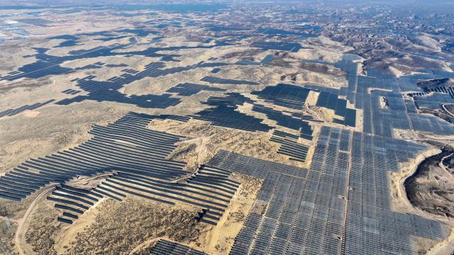 This picture shows an aerial view of solar panels on hilltops at the Yinchuan Fourth Photovoltaic Power Station in Yinchuan, in China’s northern Ningxia region on December 17, 2025. (Photo by AFP) / China OUT