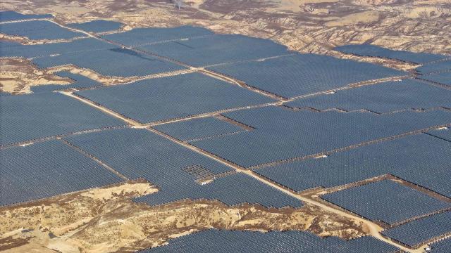 This picture shows an aerial view of solar panels on hilltops at the Yinchuan Fourth Photovoltaic Power Station in Yinchuan, in China’s northern Ningxia region on December 17, 2025. (Photo by AFP) / China OUT