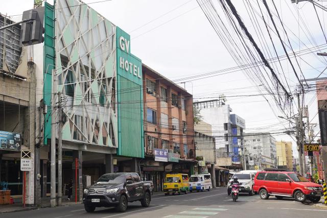 The facade of GV hotel is seen in Davao City, in the Philippines' southern island of Mindanao, where father-and-son duo Sajid and Naveed Akram stayed during their visit in November, weeks before they allegedly killed 15 people on Bondi Beach in Australia. Australian police are investigating whether the pair met with Islamist extremists during a visit to the Philippines weeks before the shooting. (Photo by Ferdinandh CABRERA / AFP)