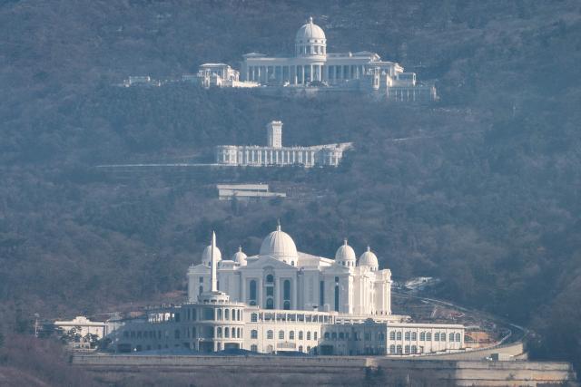 This pictures shows a general view of the entrance to the Cheon Jeong Gung (Top), the Unification Church leader Han Hak-ja's residence in Gapyeong on December 18, 2025. (Photo by Shin Yong-Ju / AFP)
