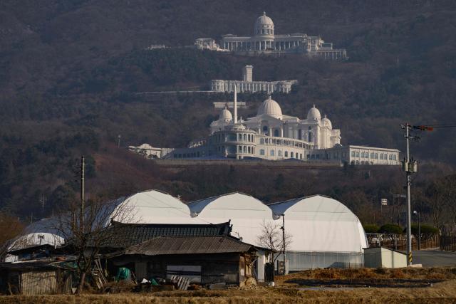 This pictures shows a general view of the entrance to the Cheon Jeong Gung (Top), the Unification Church leader Han Hak-ja's residence in Gapyeong on December 18, 2025. (Photo by Shin Yong-ju / AFP)
