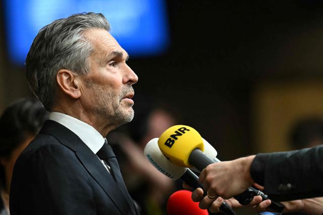 Netherlands' outgoing Prime Minister Dick Schoof speaks to the press as he arrives to attend the European Council meeting in Brussels on December 18, 2025. European Unions leaders meet in Brussels on December 18 and 19, 2025, to discuss in particular the need to support Ukraine, transatlantic relations and the EU's strategic autonomy. (Photo by NICOLAS TUCAT / AFP)