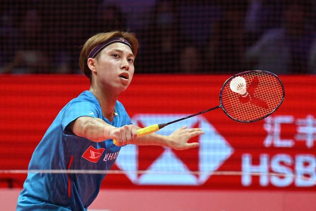 Japan’s Kodai Naraoka hits a return to China’s Li Shifeng during their men's singles match at the BWF Badminton World Tour Finals at the Hangzhou Olympic Sports Centre Gymnasium in Hangzhou, in eastern China's Zhejiang province on December 18, 2025. (Photo by Jade Gao / AFP)