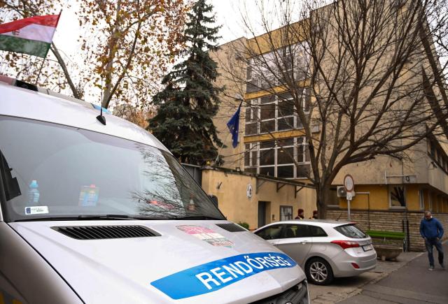 (FILES) Hungarian police cars stand in front of the compound of the "Budapest reformatory detention centre" in the third district of Budapest on December 10, 2025. With four months to go until key Hungarian elections, mounting public outrage over perceived inaction on child abuse allegations in state-run institutions is shrinking Prime Minister Viktor Orban's chances to hold onto power. That scandal has shaken the nationalist leader's tight grip on power and helped fuel the rise of Hungarian opposition leader Peter Magyar, a former government insider. (Photo by ATTILA KISBENEDEK / AFP)